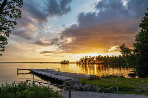 Sunset At Swedish Lake Water Pier Reflection Clouds Sky Sweden