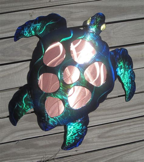 The finish consists of varying shades of green and each piece is unique. Sea Turtle Metal Wall Art Sculpture by Robert Blackwell