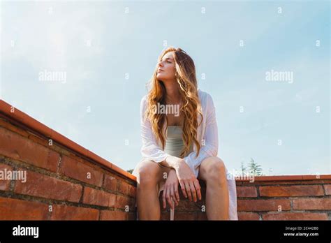 Woman Sunbathing On Rooftop Hi Res Stock Photography And Images Alamy