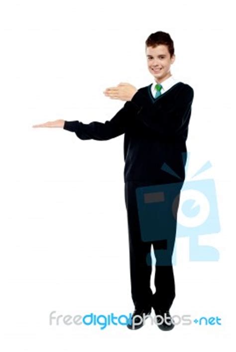 School Boy Introducing Gesture Stock Photo - Royalty Free Image ID 100102428