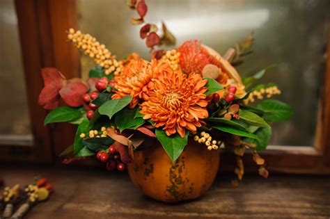 Pumpkin With A Beautiful Bouquet Of Autumn Flowers Inside