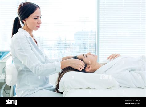 Cosmetology Image Of Beautician Doing Head Massage Or Prepare Female Patient To Hardware