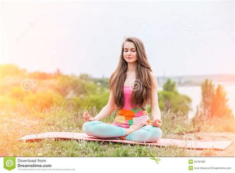 Pretty Woman Doing Yoga Exercises On Nature Landscape Stock Image
