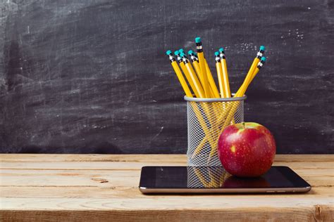Back To School Background With Tablet Pencils And Apple Over