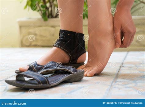 Woman Rubbing Her Feet Stock Image Image Of Feet Bare 130305717