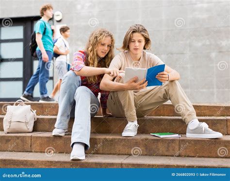 Teenagers Doing Homework On Stairs Outdoors Stock Image Image Of