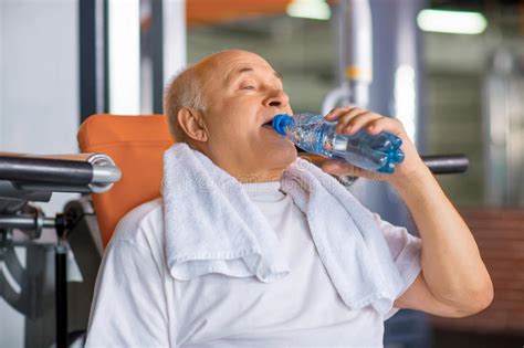 Pleasant Senior Man Drinking Water In Gym Stock Photo Image Of