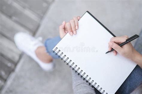 Top View Female Hands With Pen Writing On Notebook Notepad Sitting