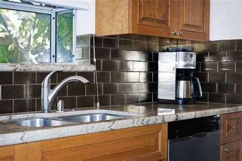 Each pack contains one square foot of flooring, and the glass is made from 50% recycled material as well. Peel and Stick Backsplash Tile Guide