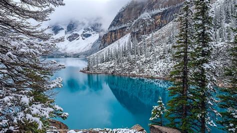 4551303 Turquoise Snow Canada Moraine Lake Trees Water Clouds