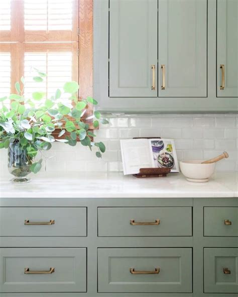 The actress's kitchen, featured here, beautifully combines sage green cabinets with white marble and other neutral elements for a crisp, clean look. Muted green kitchen || Colour in the kitchen - FIRST SENSE ...