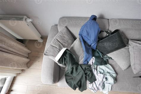 Messy Clothes On Sofa At Home 21607188 Stock Photo At Vecteezy