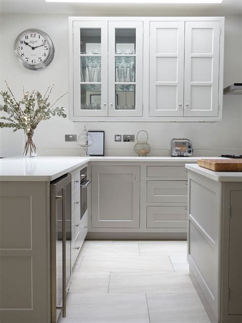 Using white cabinets in the kitchen is a smart design move, as they'll give the space a light and airy feeling. Grey and White Kitchen Ideas and Photos | Houzz