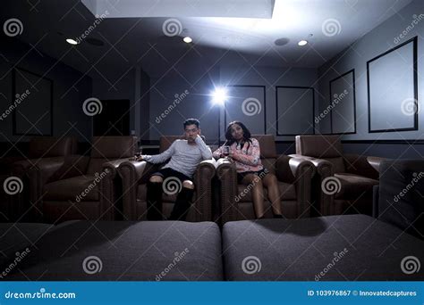 interracial couple on a home theater date stock image image of lifestyle asian 103976867