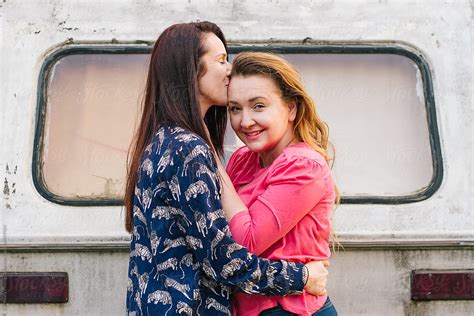 Lesbian Couple Kiss Each Other By Stocksy Contributor Branislava
