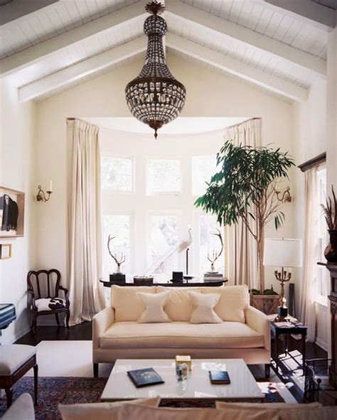 Designing cathedral ceilings showcases several features such as installing support beams or striking hardware fixtures which create a unique and distinct combination with the beams. 20 Spacey Cathedral Ceiling Living Room Designs