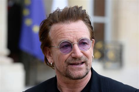 what is u2 singer bono s net worth and why does he always wear tinted glasses