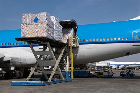 Loading Cargo Onto Plane Stock Photos Pictures And Royalty Free Images