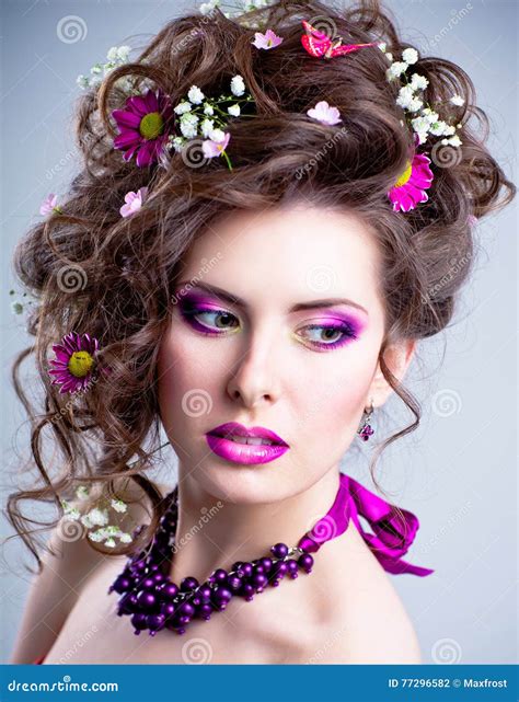 Young Beautiful Woman With Flowers In Her Hair And Bright Makeup Stock