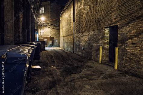 Dark And Scary Downtown Urban City Street Corner Alley With An Eerie