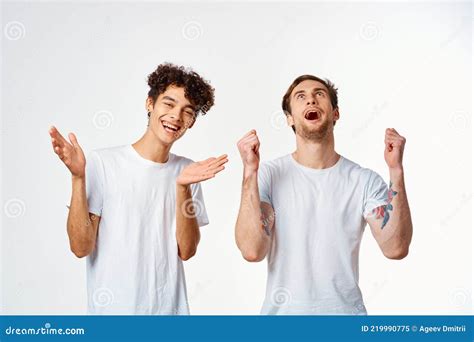 Two Men In White T Shirts Are Standing Next To Friendship Emotions Stock Image Image Of Couple