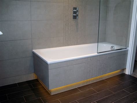 Tiled Bath Panels With Recessed Led Lighting Below Plinth