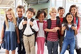 Group Portrait Of Elementary School Kids In School Corridor Stock Photo ...