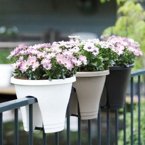 Black color goes well with everything and if your summers are cool, hang black planter boxes over a railing to grow your favorite flowers. Greenbo Railing Planter » Gadget Flow