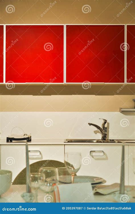 Interior Of Modern Kitchen Equipment White And Red Cabinets Stock