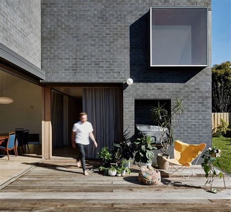 This Black Brick House Features Generous Spaces With A High Degree Of