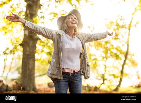 Cheerful Mature Woman With Arms Outstretched Stock Photo Alamy
