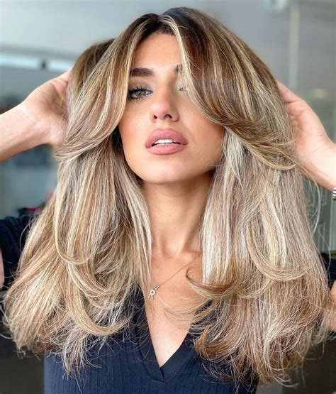 50 Best Layered Haircuts And Hairstyles For 2023 Hair Adviser Medium Layered Hair Layered