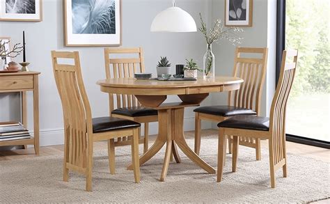 The table can be extended with two original intermediate leaves. Best 20+ of Circular Extending Dining Tables And Chairs
