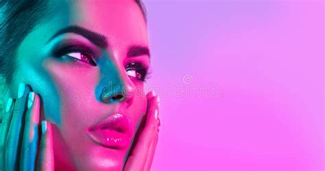Fashion Model Woman In Colorful Bright Lights With Trendy Makeup And