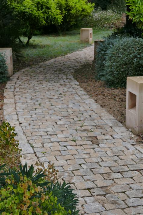 Cobble Stone Path Links The Various Areas Of This Mallorcan Garden