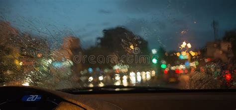 Rain Drops On Windshield Glass Window With Road Light Bokeh Stock Image