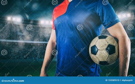 Soccer Player Ready To Play With Ball In His Hands At The Stadium Stock