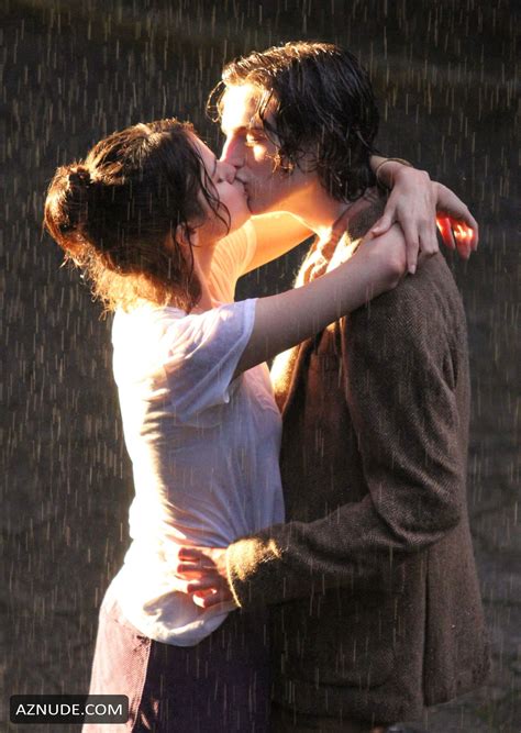 Selena Gomez And Timothee Chalamet Kissing During A Romantic Rainy