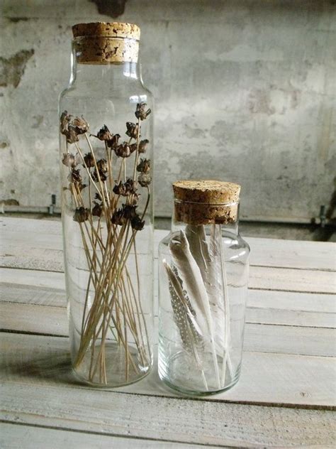 Fresh citrus drinks with lavender. corked jars filled with dried flowers and feathers ...