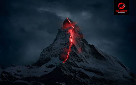 The Matterhorn Lit Up At Night By A Trail Of Hikers