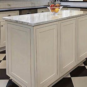 White kitchen cabinet end panel and baseboard kitchen in 2019. center island in white cabinets with decorative door ...