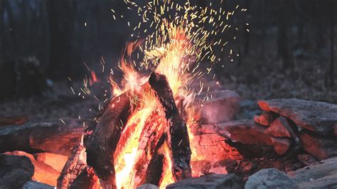 Download Wallpaper 3840x2160 Bonfire Fire Sparks Stones Firewood