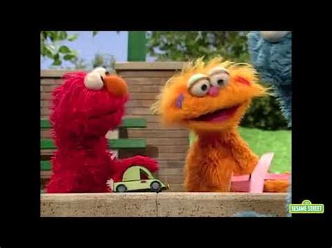 The guest who is standing goes around the circle, tapping each child on the head and saying elmo, elmo, elmo until he randomly chooses to name one child zoe. Sesame Street - Different Tastes with Elmo, Zoe, and ...