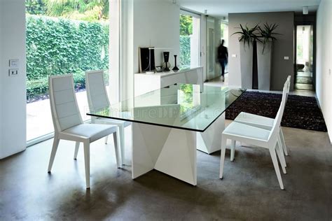 Modern dining tables are available in different styles, colors and made of different materials or with various combinations of materials. White Ultra Modern Dining Table w/Two Pedestal Legs & Glass Top