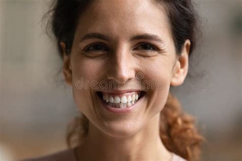 Closeup Portrait Of Young Hispanic Woman Smiling Looking At Camera