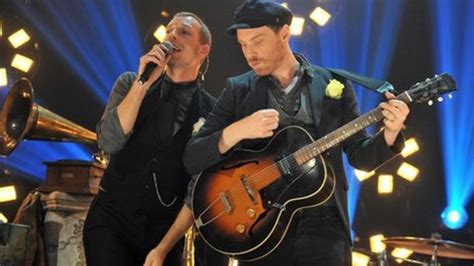 Jonny Buckland Gives Coldplay Disc To Pantymwyn Village Hall