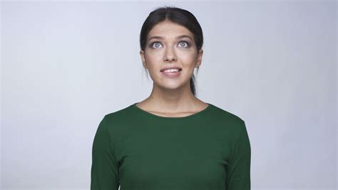 Confused Shy Brunette Woman Looking At Camera Stock Footage By