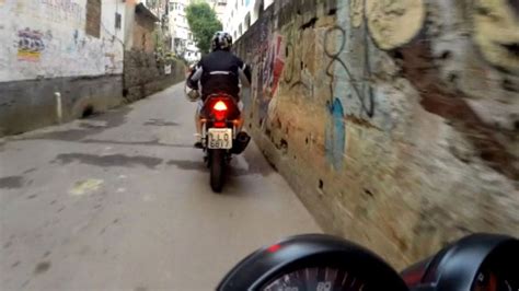 rio motorbike ride through favela backstreets bbc news