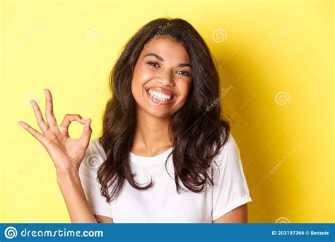Close Up Of Satisfied African American Woman Showing Okay Sign And Smiling Recommending