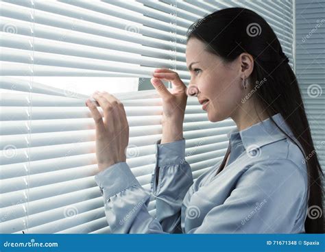 Office Worker Looking Through Window Blinds Stock Photo Image Of